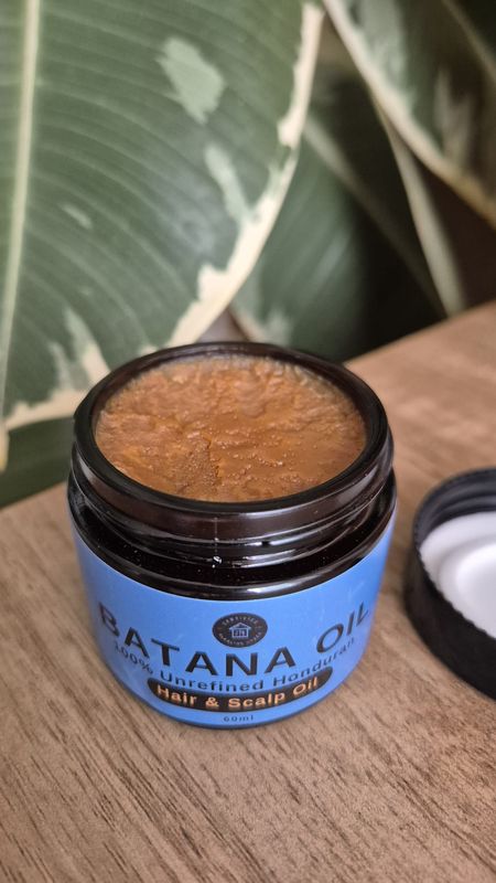 Batana oil in open jar